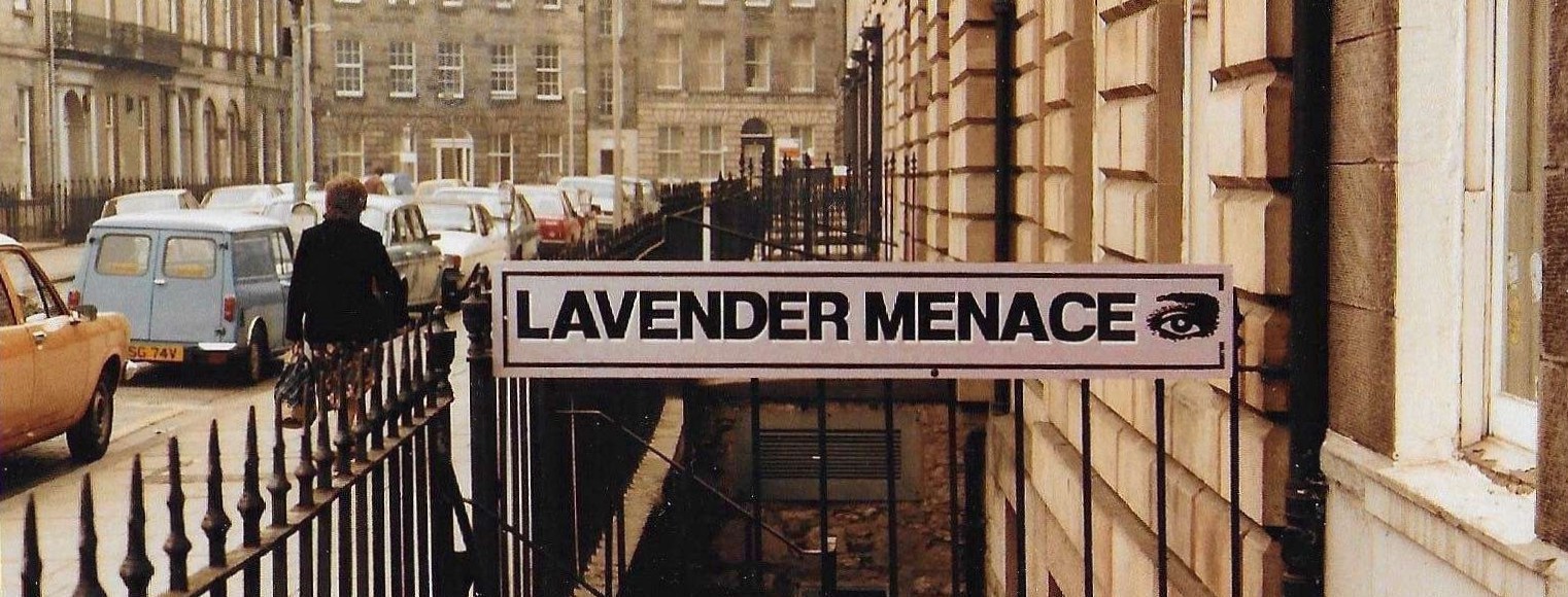 A photo of the Lavender Menace sign outside of the original bookshop in the 1980s
