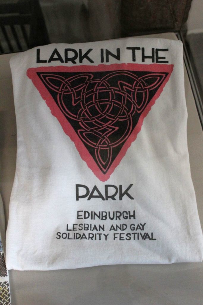 A tshirt advertising a festival called Lark in the Park. A full image description is available in the audio file below.
