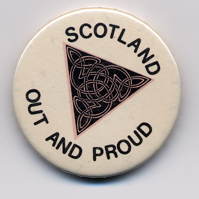 A badge with the text "Scotland Out and Proud" and decorative illustration. A full image description is available in the audio file below.